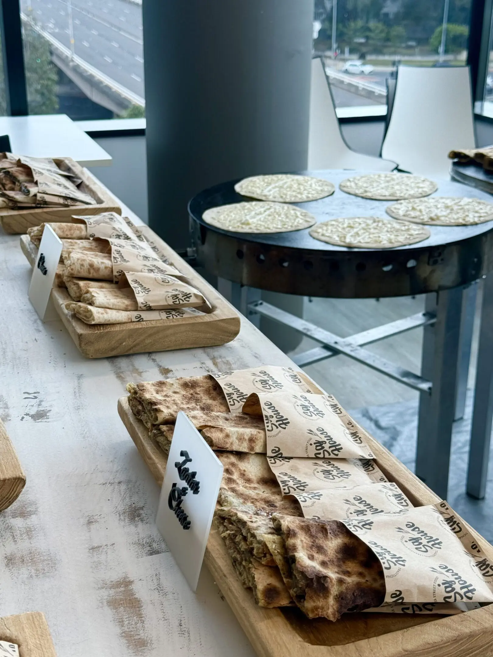 Freshly baked flatbreads displayed for sale.